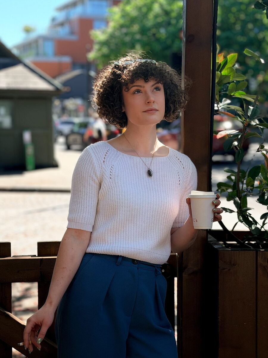 Hannah Crawford with a coffee, in conversation