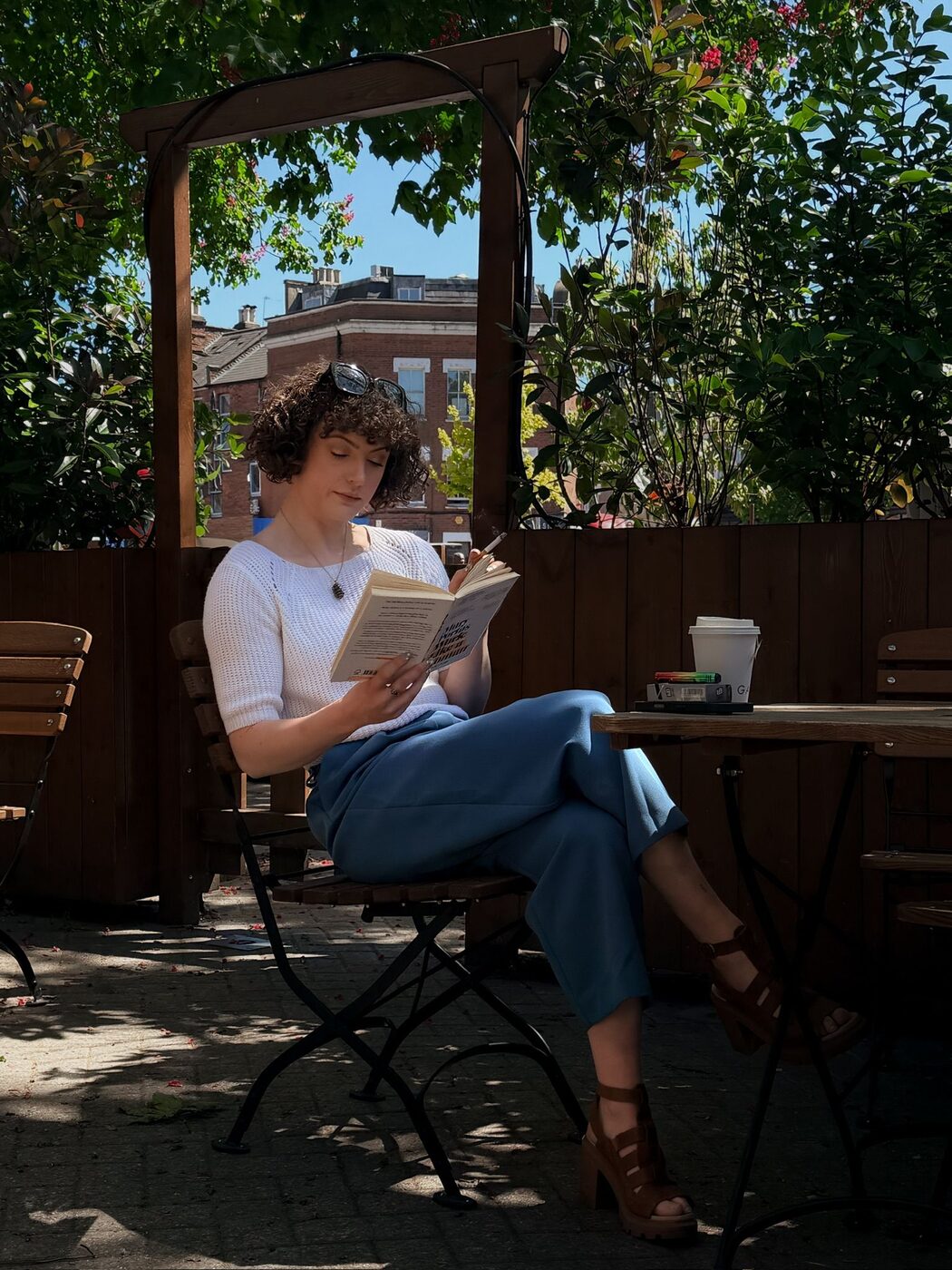 Hannah Crawford sitting and reading, portrait